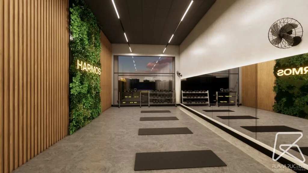 Perspectiva do Espaço Mulher Harmos, com parede verde, espelhos e halteres.